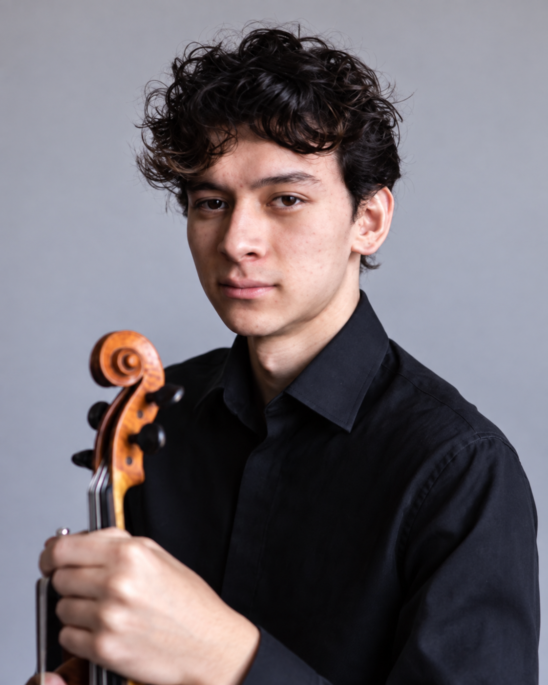 Derek Blodgett holding his violin